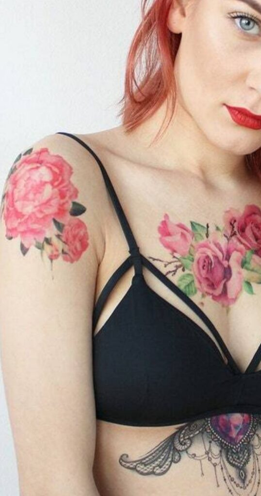 woman with flower tattoos on her chest and arm